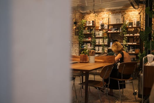 a bustling coffee shop with customers reading